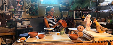 Merle Lambeth unloading a kiln.